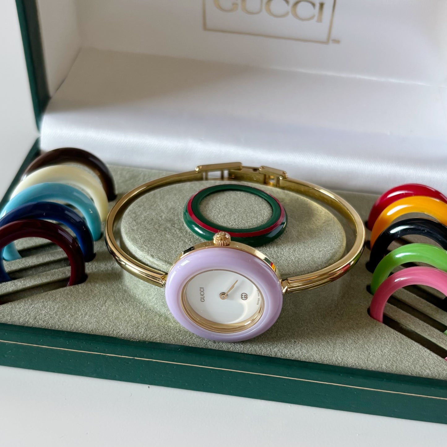 Gucci 1990s Interchangeable Bezel Gold Plated Bangle Watch with 12 bezels, case