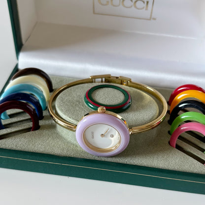 Gucci 1990s Interchangeable Bezel Gold Plated Bangle Watch with 12 bezels, case