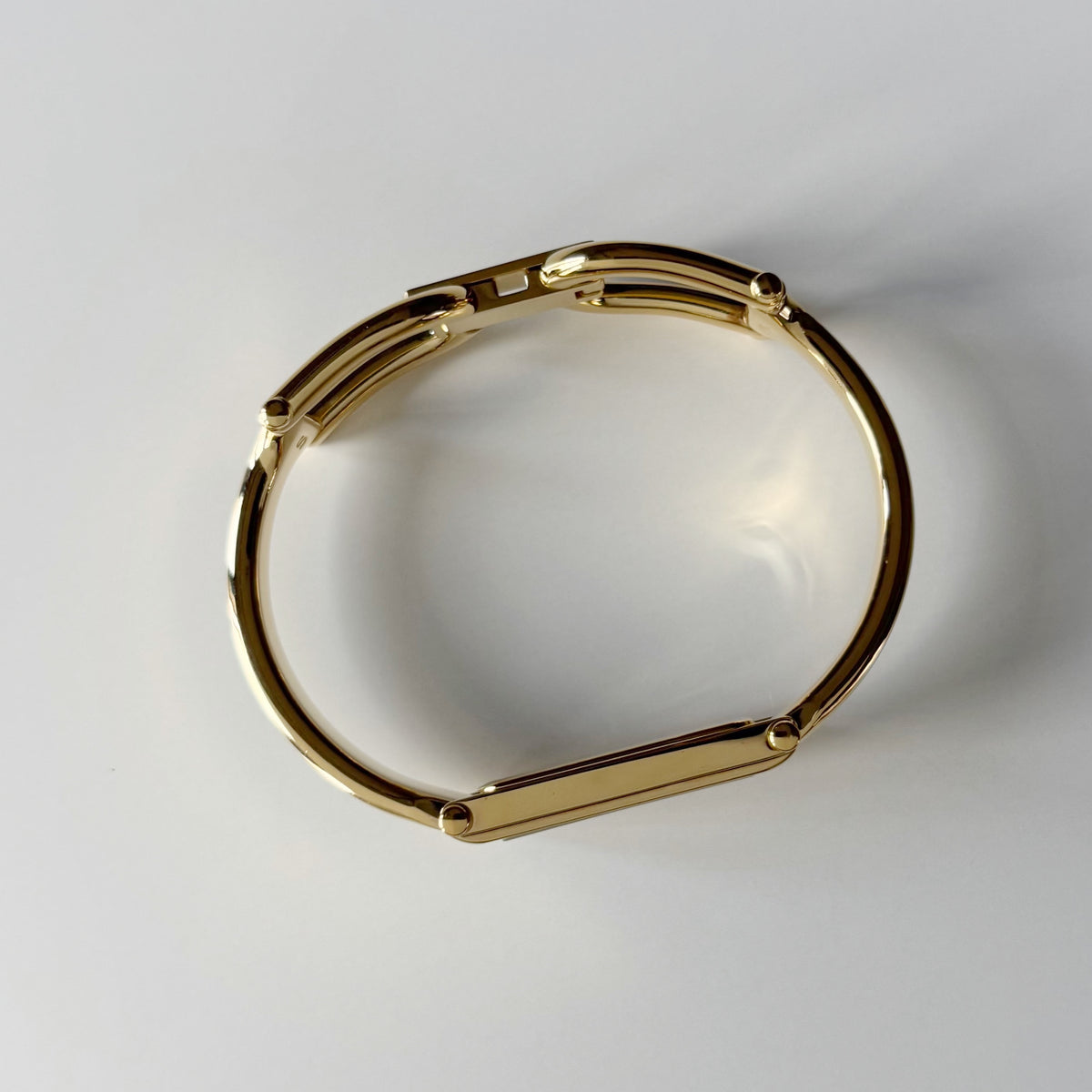 Gucci 1990s Rectangular Gold Dial Gold Plated Bangle Watch (Small)
