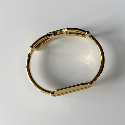 Gucci 1990s Rectangular Gold Dial Gold Plated Bangle Watch (Small)