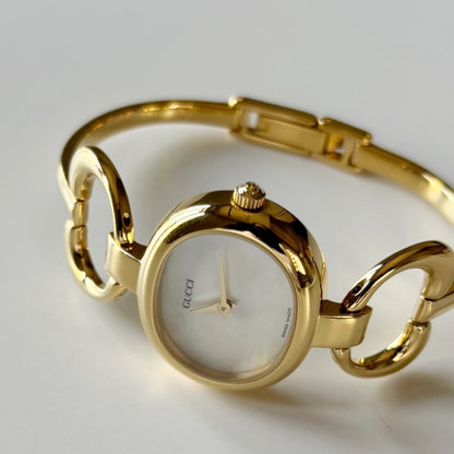 Gucci 1990s Seashell Oval Dial Gold Plated Bangle Watch (Small)