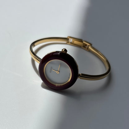 Gucci 1990s Interchangeable Bezel Gold Plated Bangle Watch with 12 bezels, case