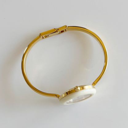 Gucci 1990s Interchangeable Bezel Gold Plated Bangle Watch with 12 bezels, case