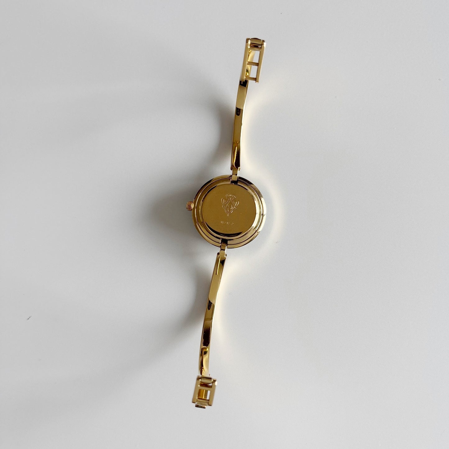 Gucci 1990s Interchangeable Bezel Gold Plated Bangle Watch with 12 bezels, case