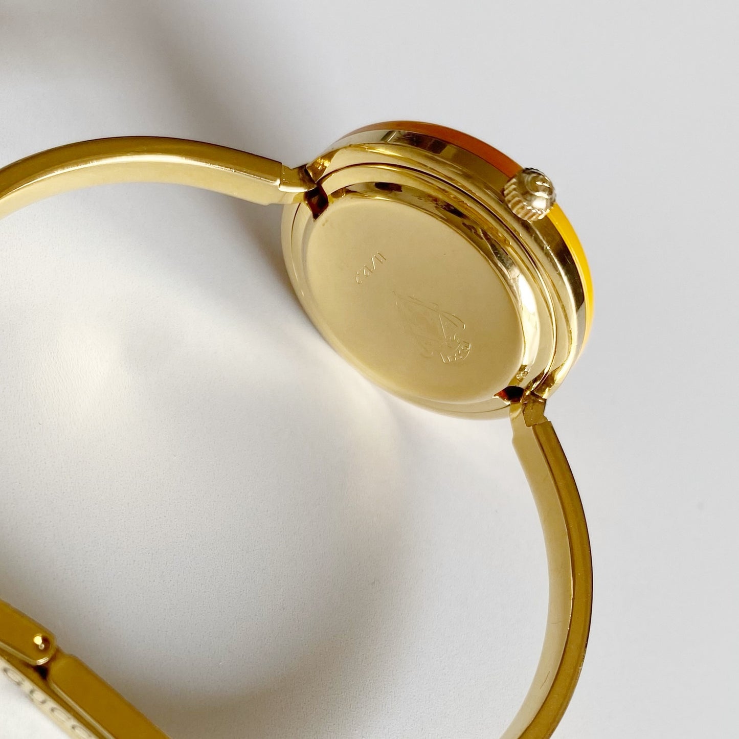 Gucci 1990s Interchangeable Bezel Gold Plated Bangle Watch with 12 bezels, case