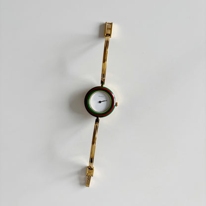 Gucci 1990s Interchangeable Bezel Gold Plated Bangle Watch with 12 bezels, case (Small)