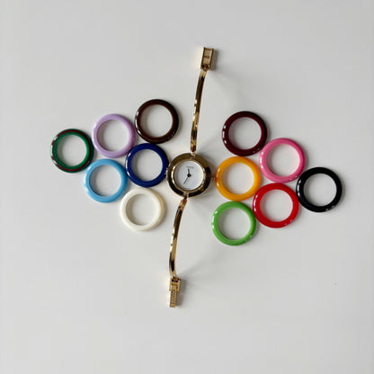 Gucci 1990s Interchangeable Bezel Gold Plated Bangle Watch with 12 bezels, case