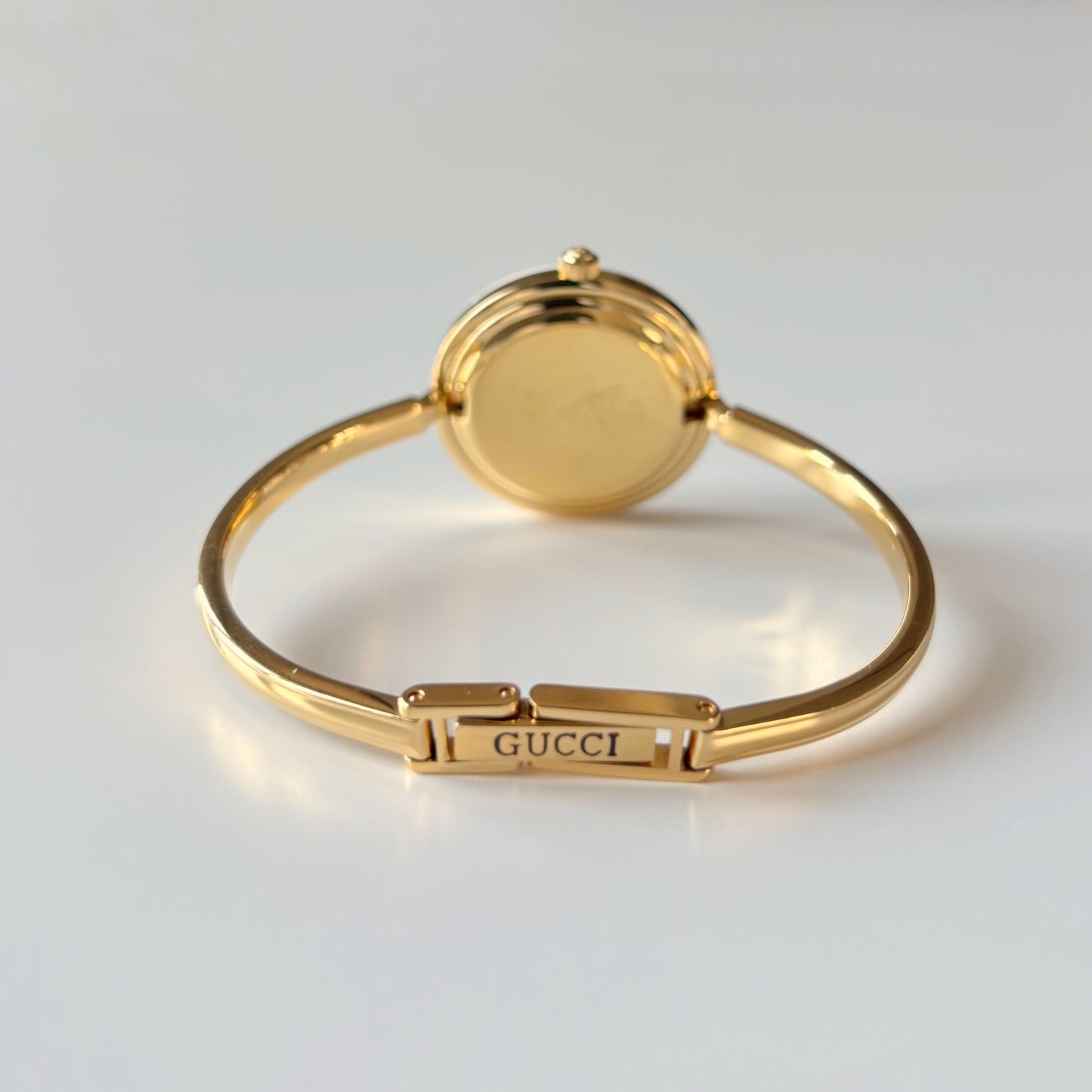 Gucci 1990s Interchangeable Bezel Gold Plated Bangle Watch with case, 12 bezels (Small)