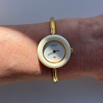 Gucci 1980s Interchangeable Bezel Gold Plated Bangle Watch with 12 bezels, case