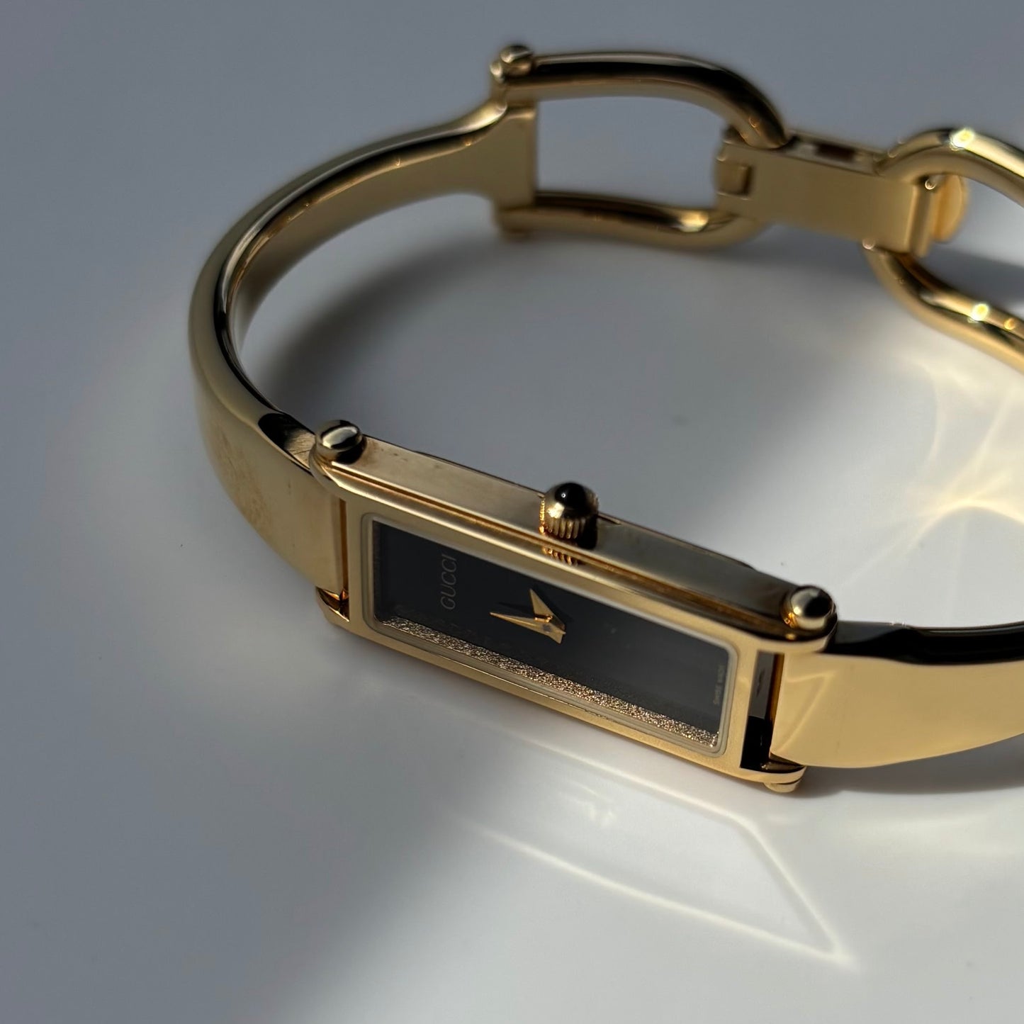 Gucci 1990s Rectangular Black Dial Gold Plated Bangle Watch