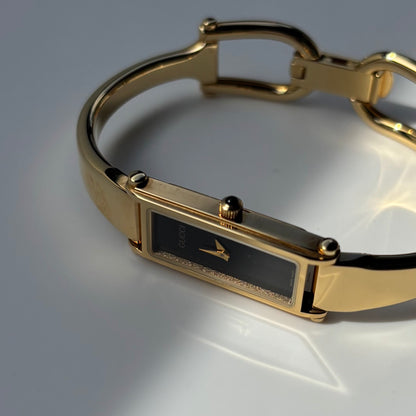 Gucci 1990s Rectangular Black Dial Gold Plated Bangle Watch