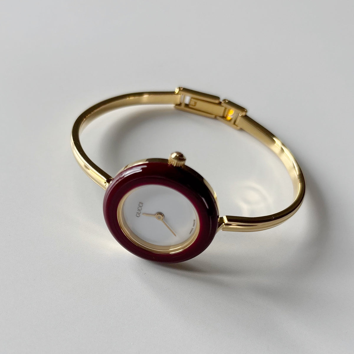Gucci 1990s Interchangeable Bezel Gold Plated Bangle Watch with 12 bezels, case