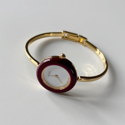 Gucci 1990s Interchangeable Bezel Gold Plated Bangle Watch with 12 bezels, case