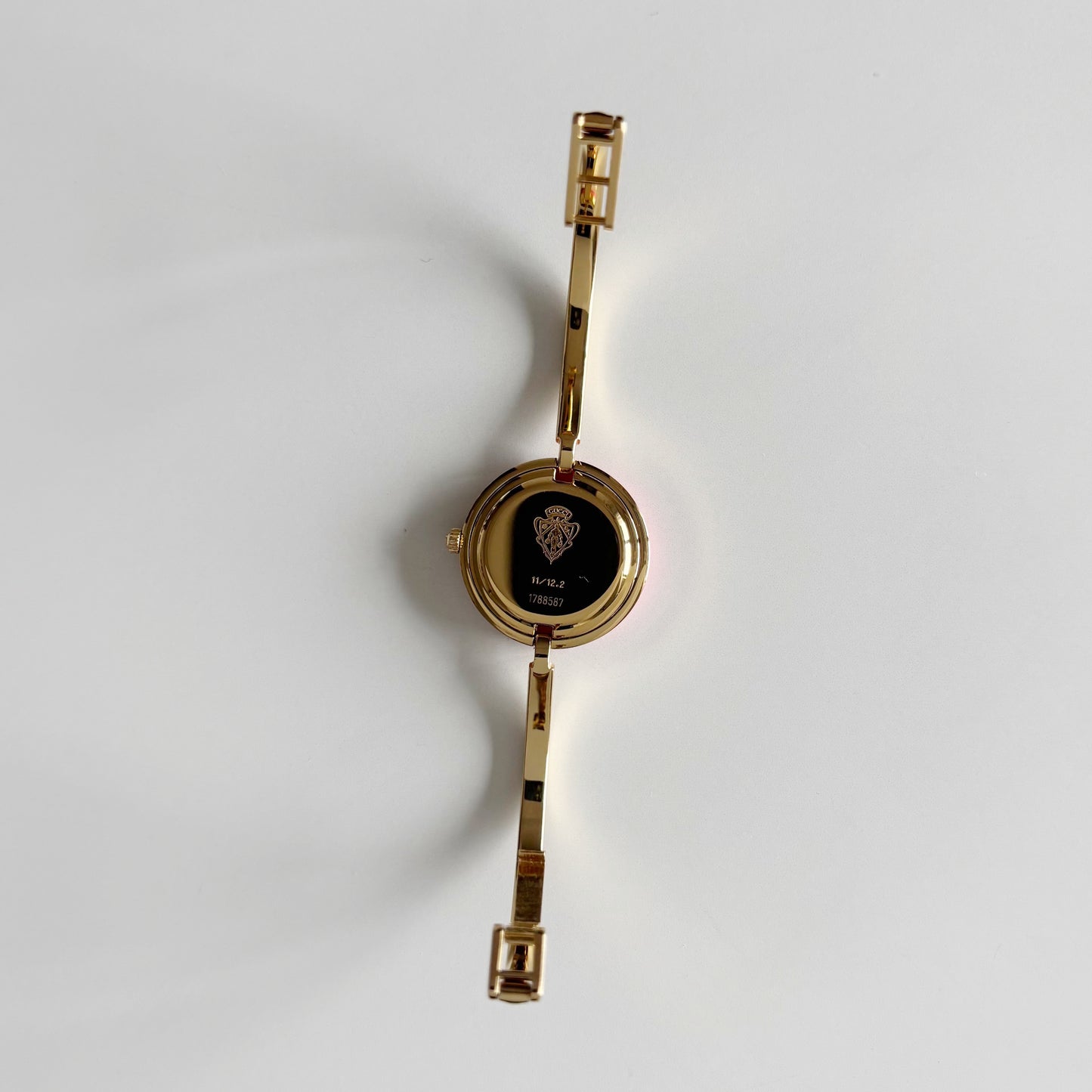 Gucci 1990s Interchangeable Bezel Gold Plated Bangle Watch with 12 bezels, case