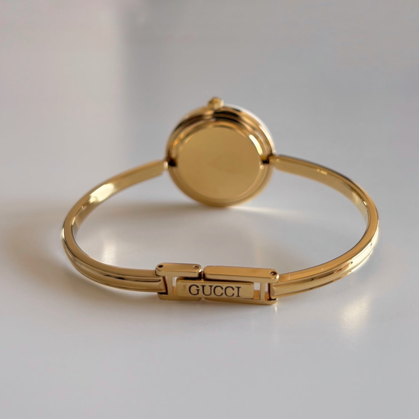 Gucci 1980s Interchangeable Bezel Gold Plated Bangle Watch with 12 bezels, case
