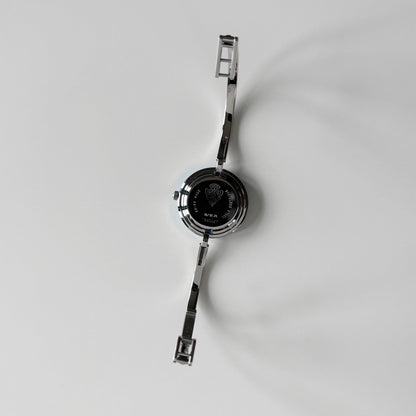Gucci 1990s Interchangeable Bezel Silver Stainless steel Bangle Watch with 12 bezels, case