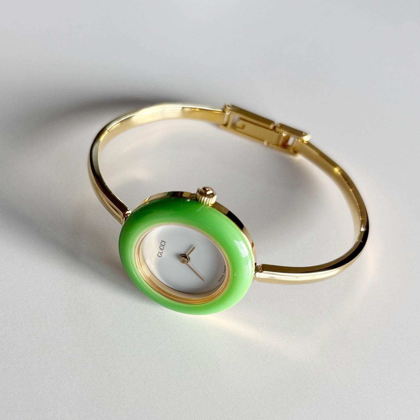 Gucci 1990s Interchangeable Bezel Gold Plated Bangle Watch with 12 bezels, case