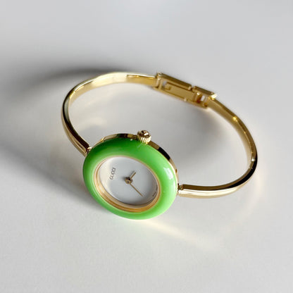 Gucci 1990s Interchangeable Bezel Gold Plated Bangle Watch with 12 bezels, case