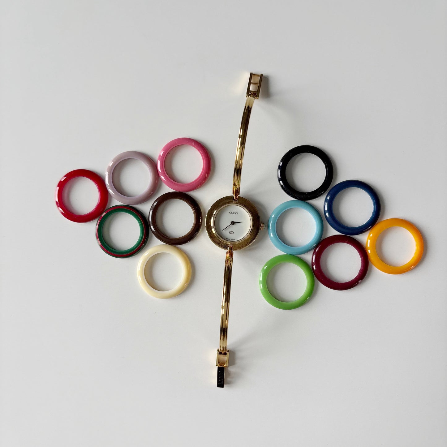 Gucci 1990s Interchangeable Bezel Gold Plated Bangle Watch with 12 bezels, case