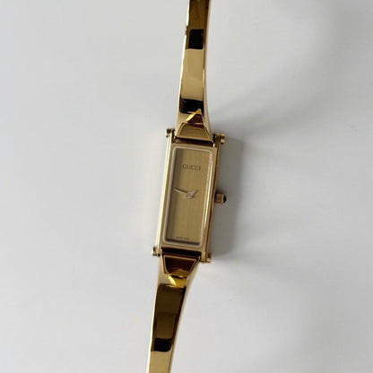 Gucci 1990s Gold Rectangular Dial Gold Plated Bangle Watch