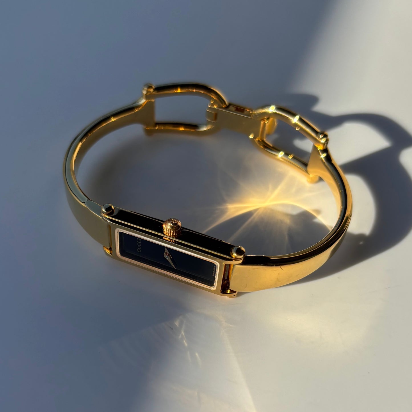 Gucci 1990s Black Rectangular Dial Gold Plated Bangle Watch
