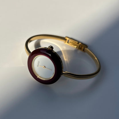Gucci 1990s Interchangeable Bezel Gold Plated Bangle Watch with 12 bezels, case