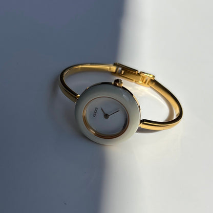 Gucci 1990s Interchangeable Bezel Gold Plated Bangle Watch with case, 12 bezels (Small)