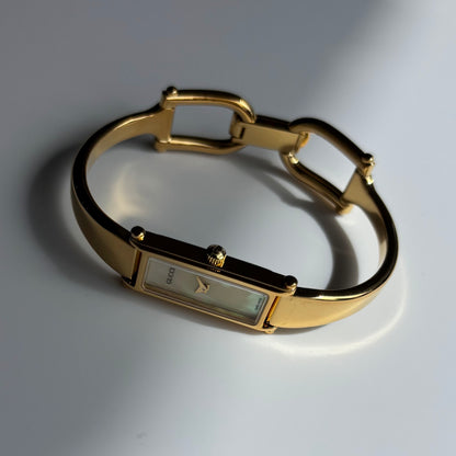 Gucci 1990s Seashell Rectangular Dial Gold Plated Bangle Watch
