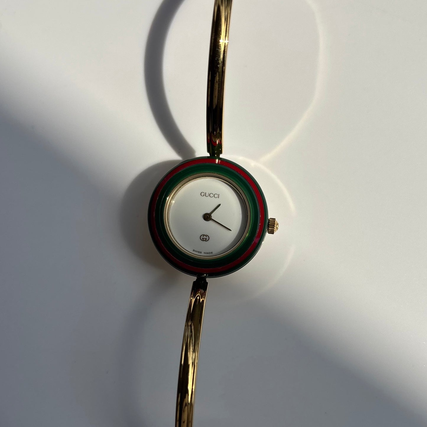 Gucci 1990s Interchangeable Bezel Gold Plated Bangle Watch with 12 bezels, case