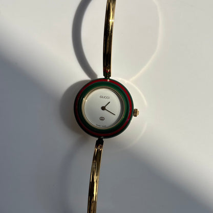 Gucci 1990s Interchangeable Bezel Gold Plated Bangle Watch with 12 bezels, case
