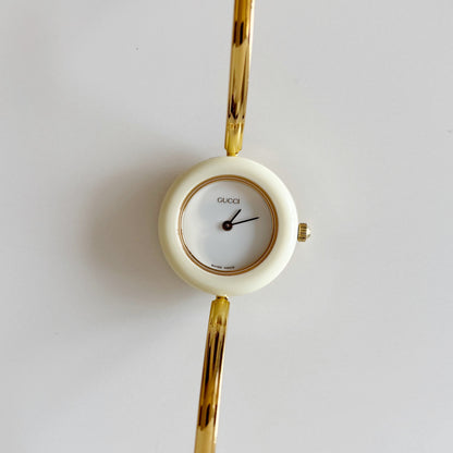 Gucci 1990s Interchangeable Bezel Gold Plated Bangle Watch with 12 bezels, case