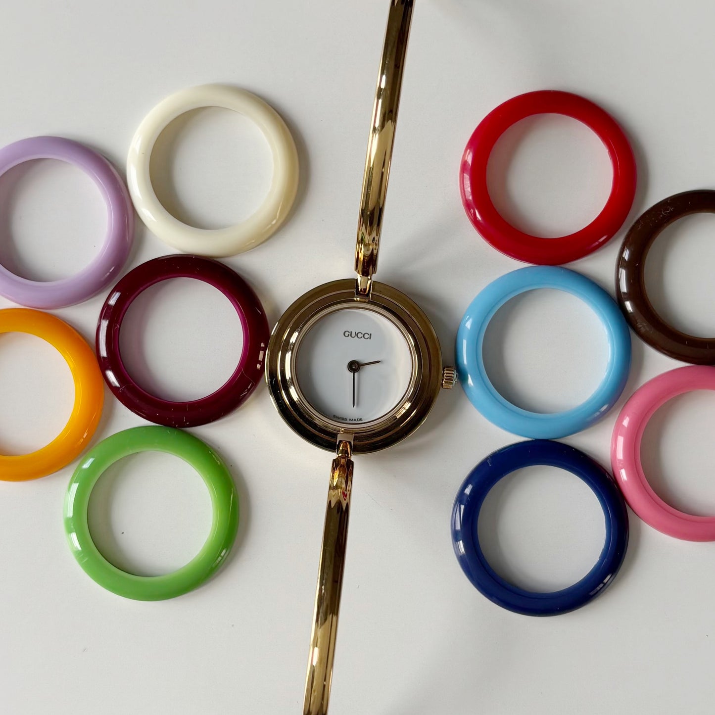 Gucci 1990s Interchangeable Bezel Gold Plated Bangle Watch with 12 bezels, case