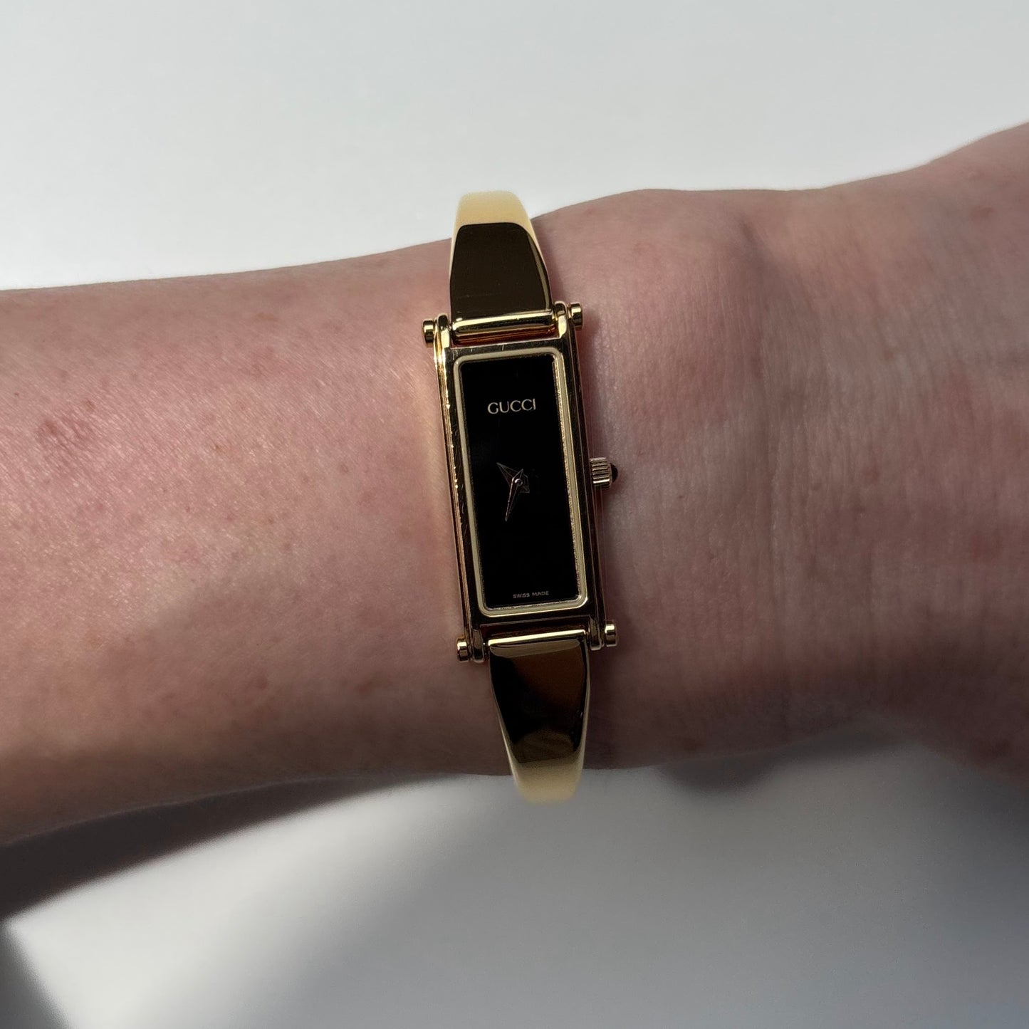 Gucci 1990s Black Rectangular Dial Gold Plated Bangle Watch