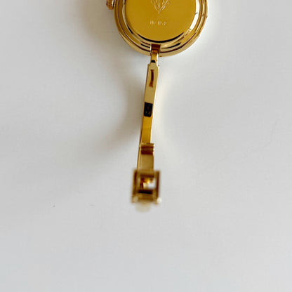 Gucci 1990s Interchangeable Bezel Gold Plated Bangle Watch with 12 bezels, case