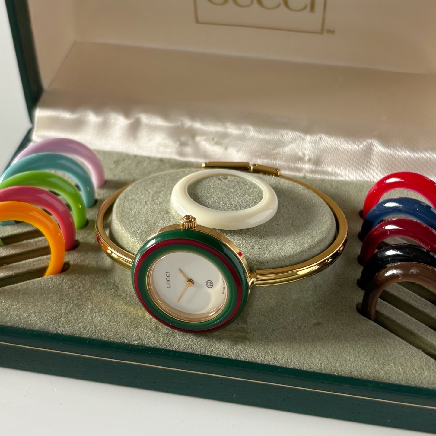 Gucci 1990s Interchangeable Bezel Gold Plated Bangle Watch with 12 bezels, case