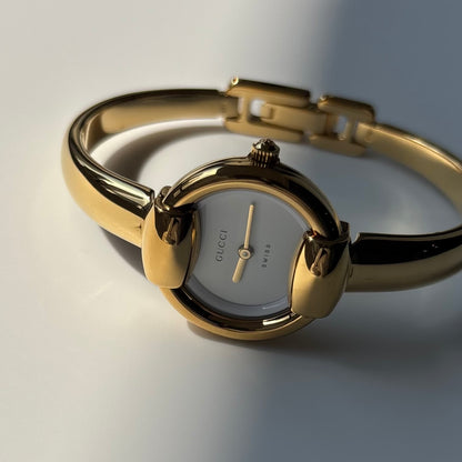 Gucci Round Dial Gold-Plated Bangle Watch