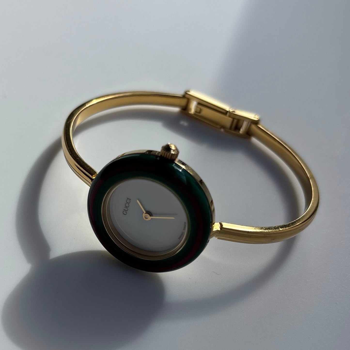 Gucci 1990s Interchangeable Bezel Gold Plated Bangle Watch with 12 bezels, case