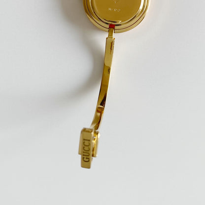 Gucci 1990s Interchangeable Bezel Gold Plated Bangle Watch with 12 bezels, case