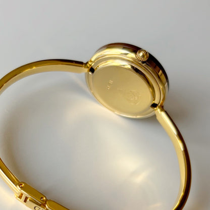 Gucci 1990s Interchangeable Bezel Gold Plated Bangle Watch with 12 bezels, case