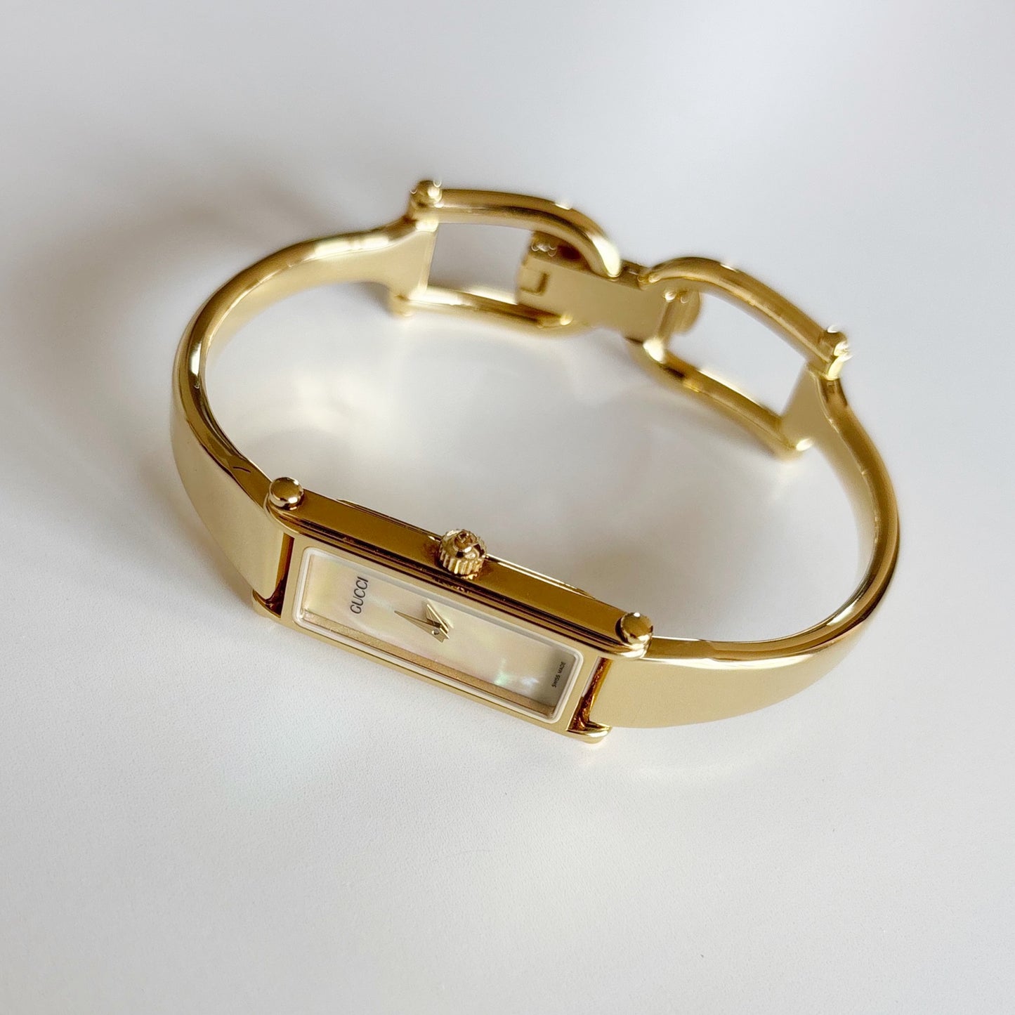 Gucci 1990s Seashell Rectangular Dial Gold Plated Bangle Watch