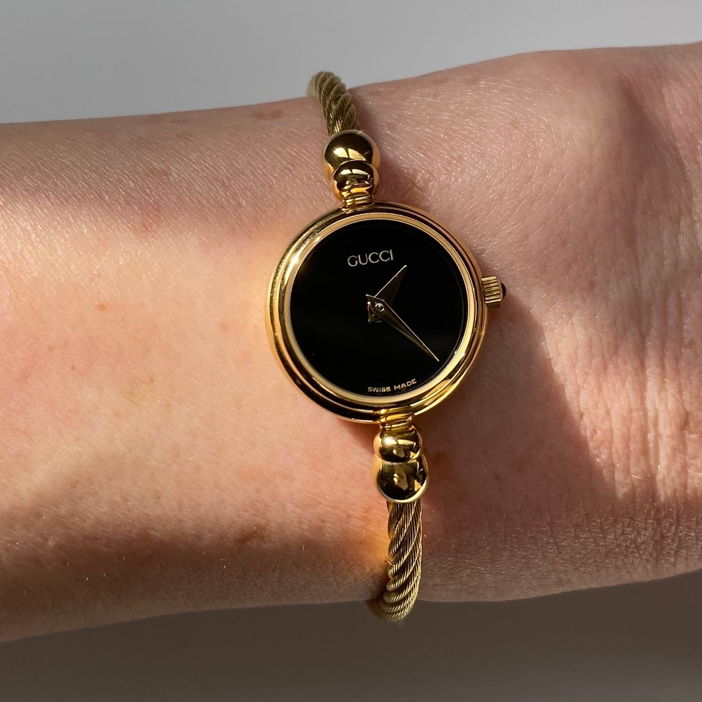 Gucci 1990s Black Dial Gold Plated Bangle Watch