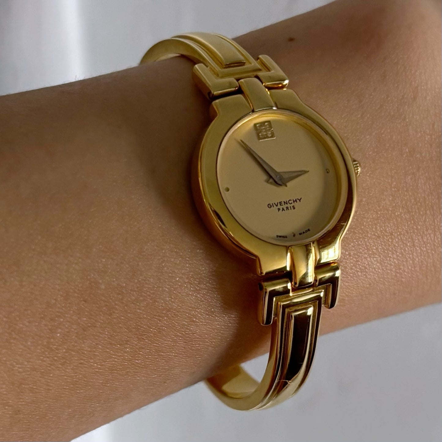 Givenchy 1990s Gold Plated Round Bangle Watch