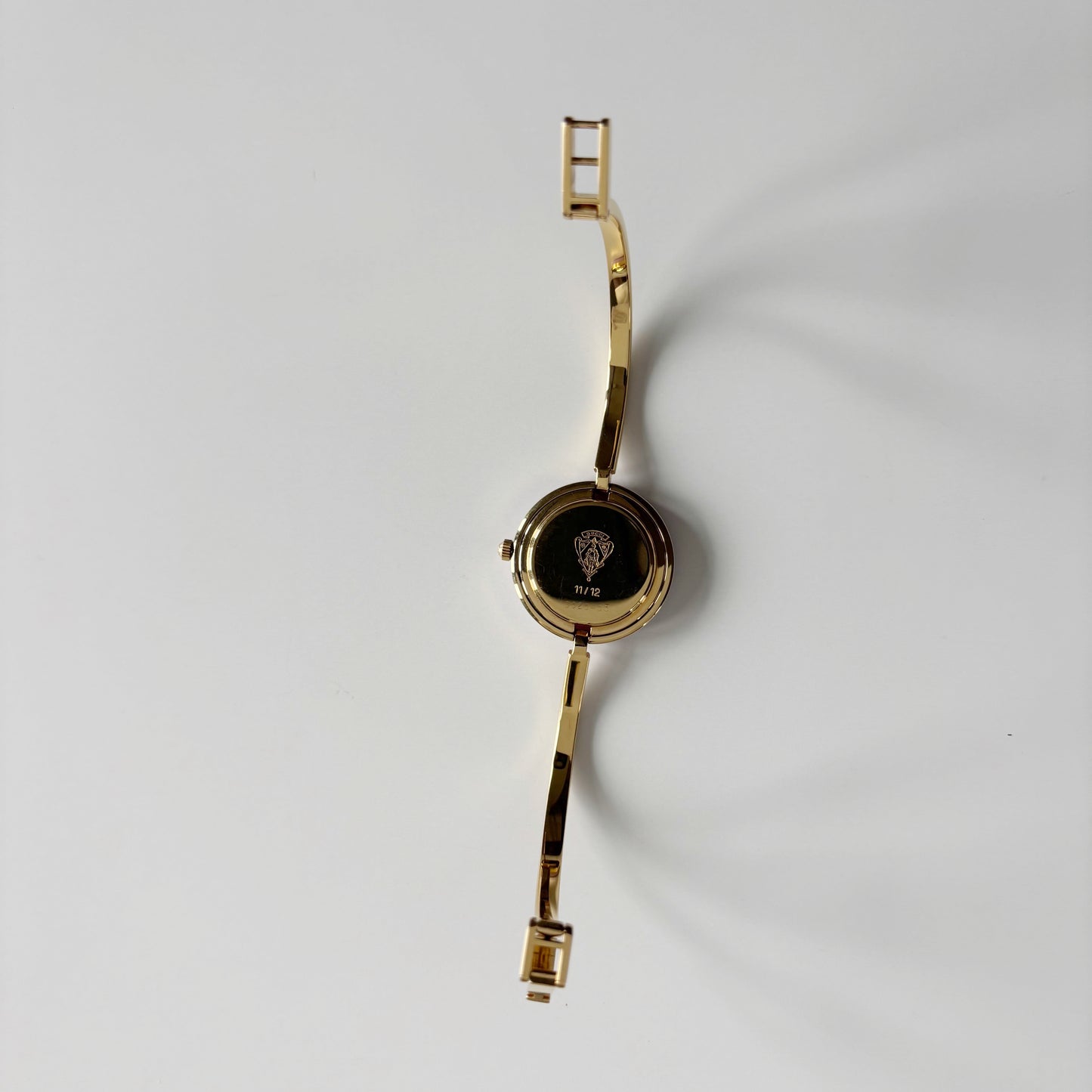 Gucci 1990s Interchangeable Bezel Gold Plated Bangle Watch with 12 bezels, case
