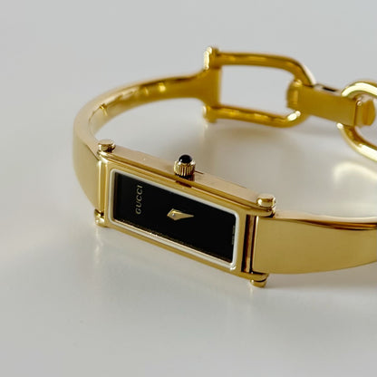 Gucci 1990s Black Rectangular Dial Gold Plated Bangle Watch