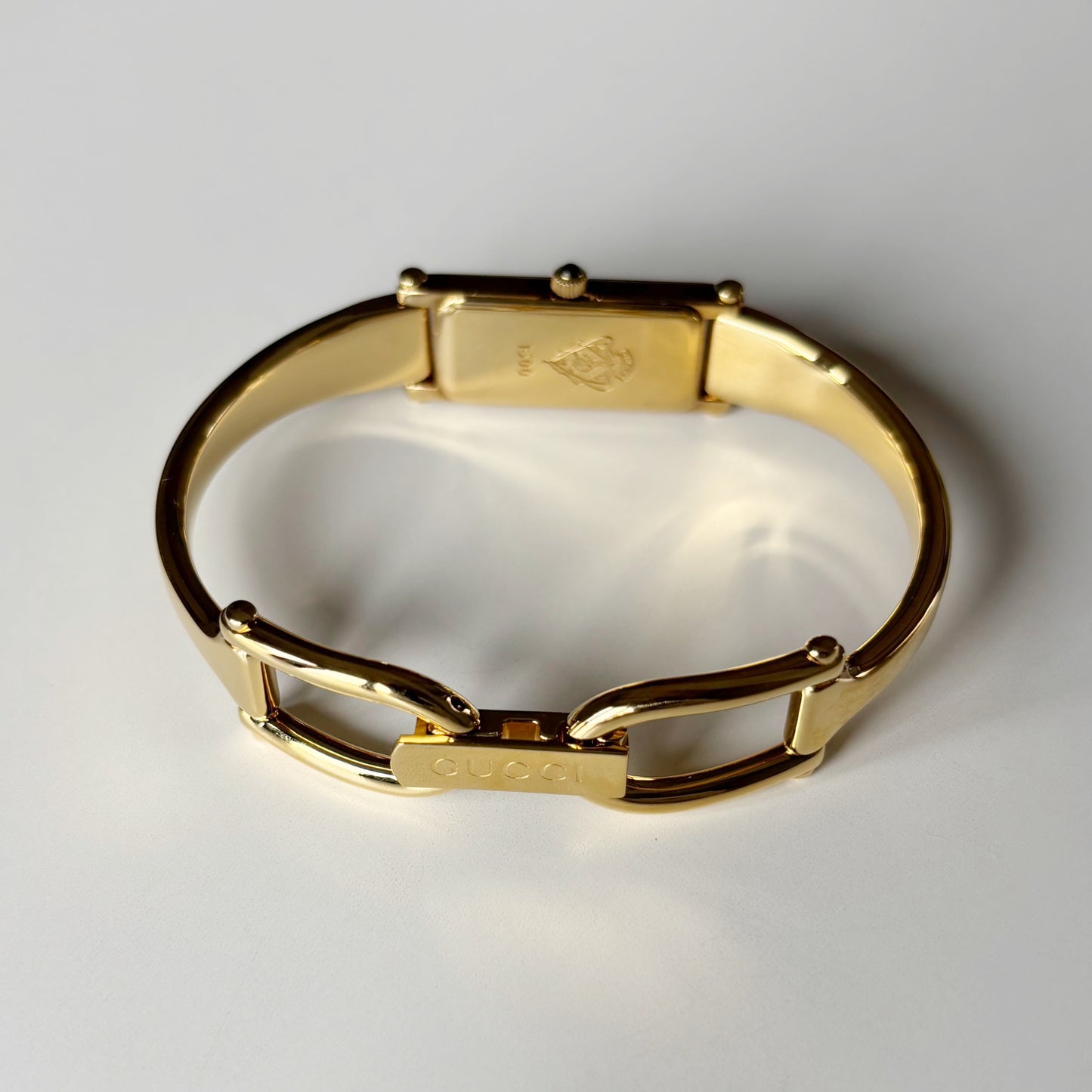 Gucci 1990s Gold Rectangular Dial Gold Plated Bangle Watch