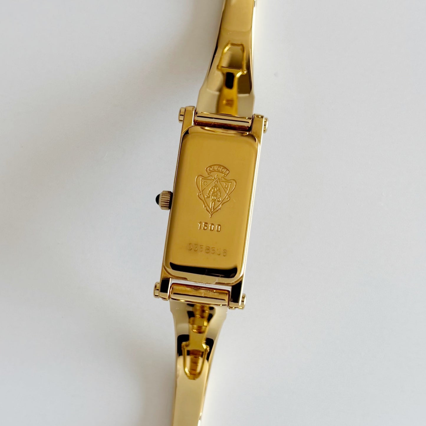 Gucci 1990s Rectangular Gold Dial Gold Plated Bangle Watch