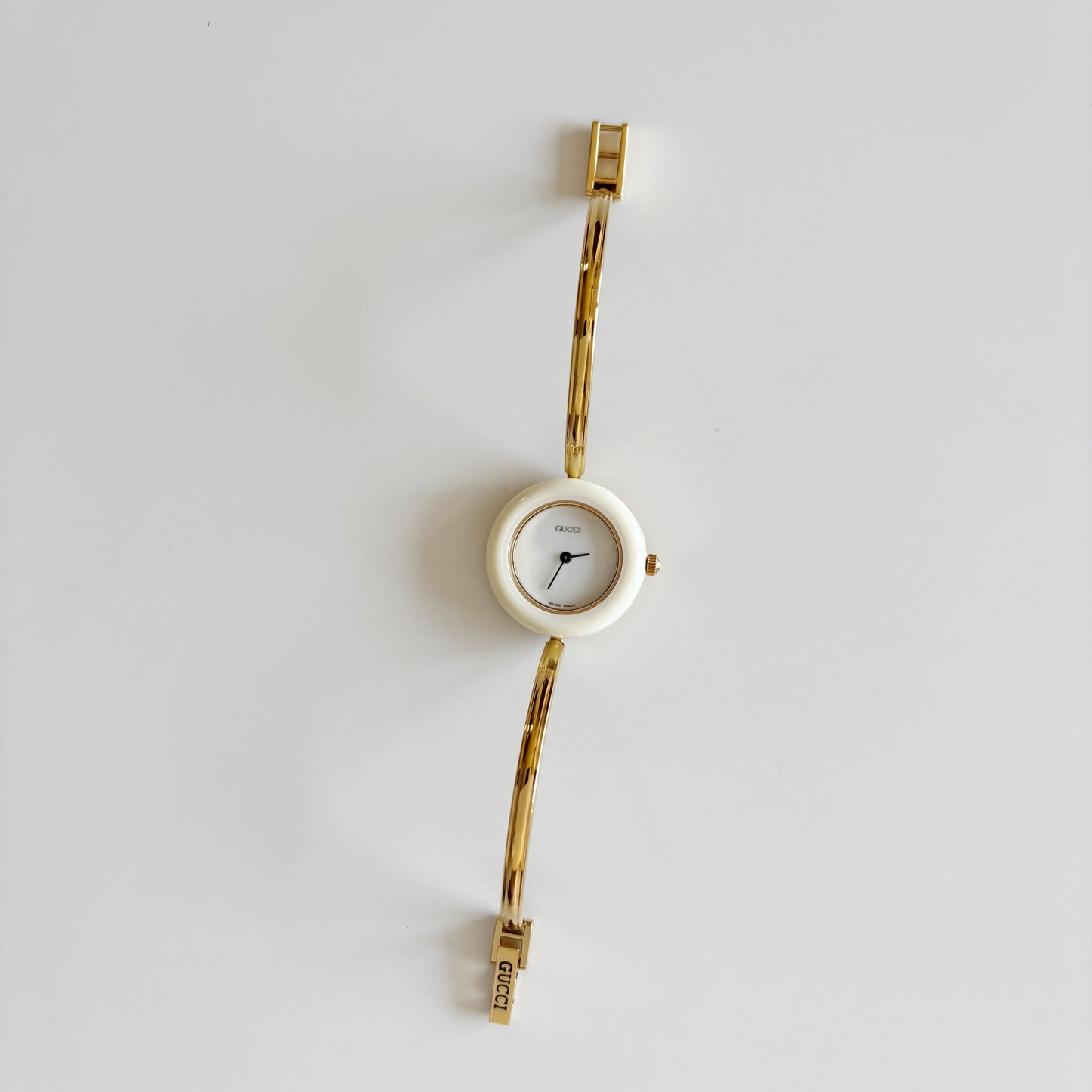 Gucci 1990s Interchangeable Bezel Gold Plated Bangle Watch with 12 bezels, case