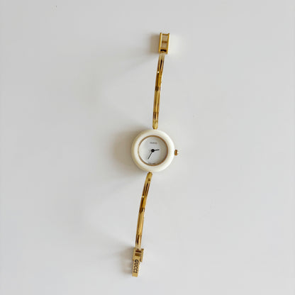 Gucci 1990s Interchangeable Bezel Gold Plated Bangle Watch with 12 bezels, case