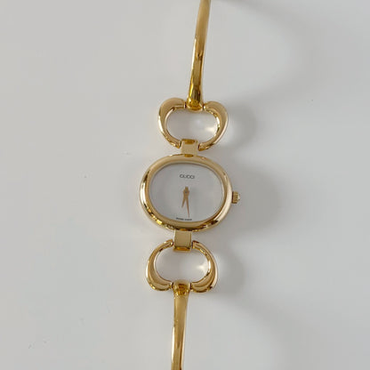 Gucci 1990s Seashell Oval Dial Gold-Plated Bangle Watch (Small)