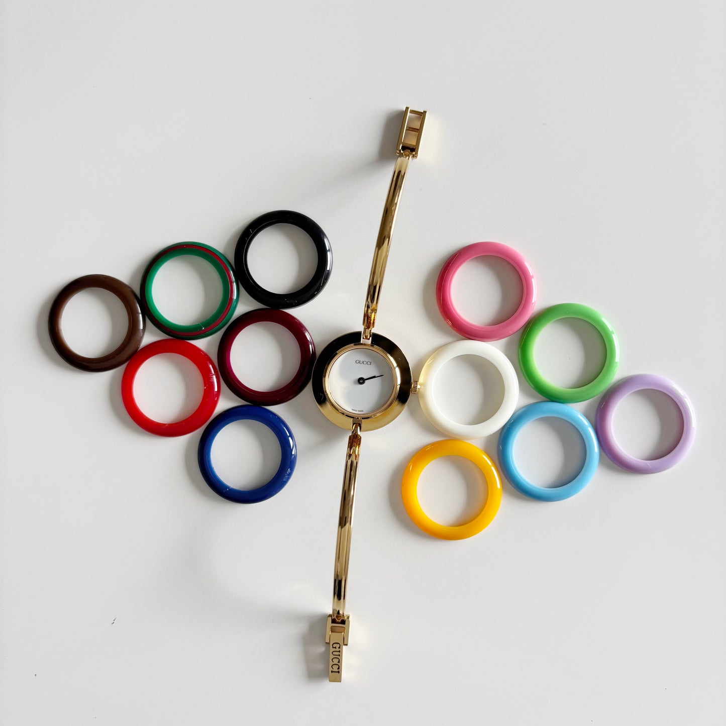 Gucci 1990s Interchangeable Bezel Gold Plated Bangle Watch with 12 bezels, case
